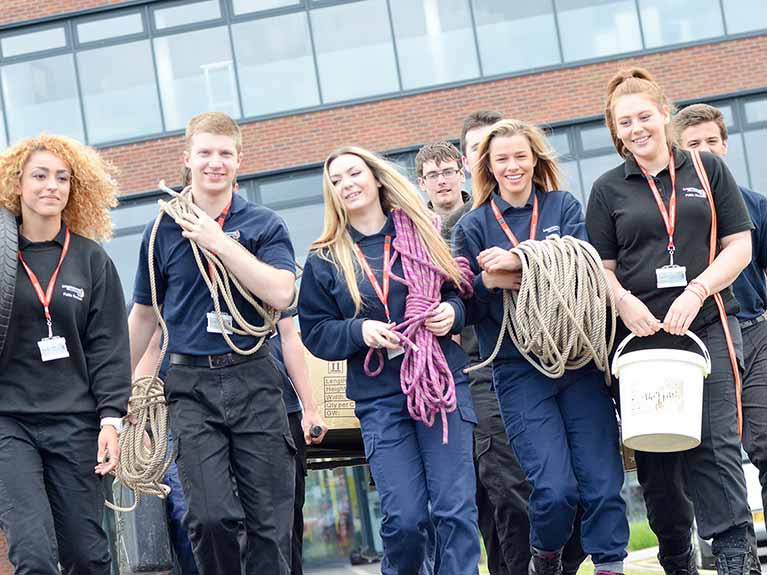 Public Uniformed Services students walking outside college building