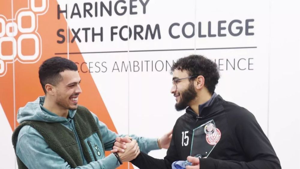 Alumni Isam (on right) meets Tottenham Hotspur defender Pedro Porro (left)